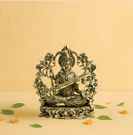 Brass Saraswati on Sofa